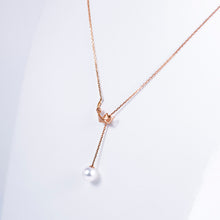 "Origaminx Boat" 18K gold and Akoya pearl, origami-shaped necklace